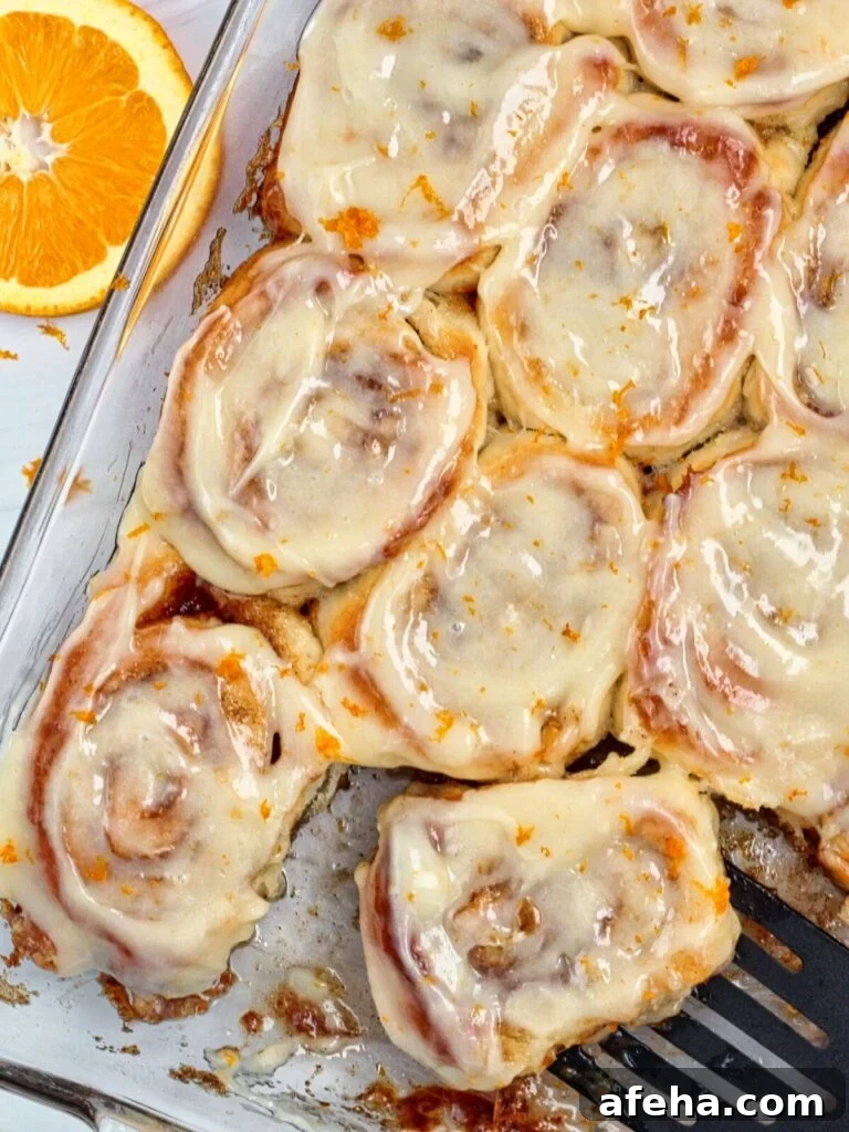 baking pan full of six large orange rolls