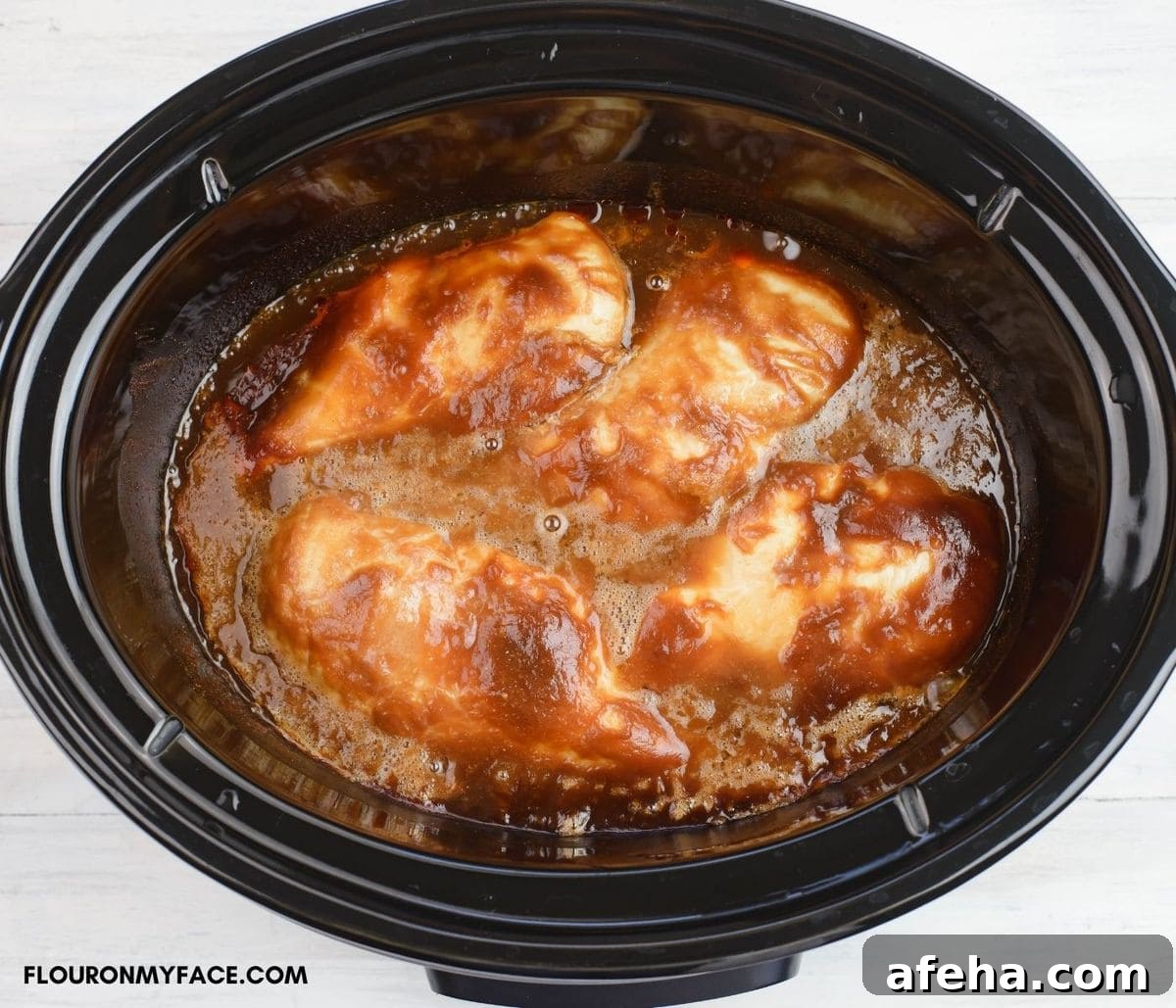 Crock Pot Barbecued Chicken before shredding in a slow cooker.