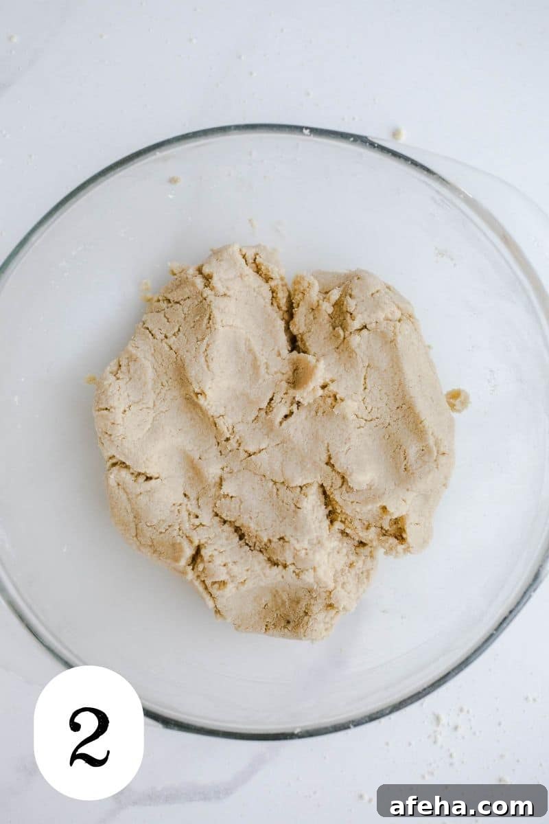 Gluten-free pastry dough in a glass bowl.