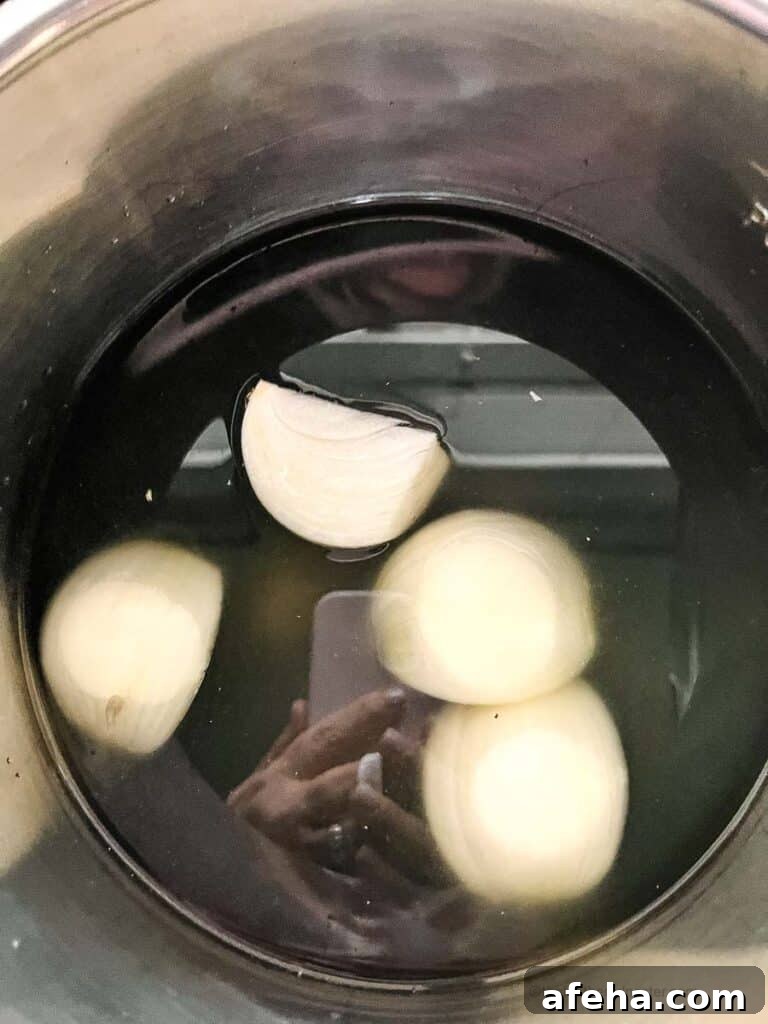 sliced onions placed into an Instant Pot.
