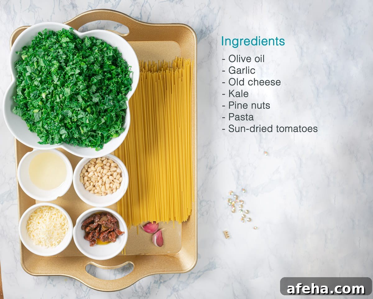 Ingredients Kale Pesto Pasta on the left on a golden tray. To the right a text description of the ingredients