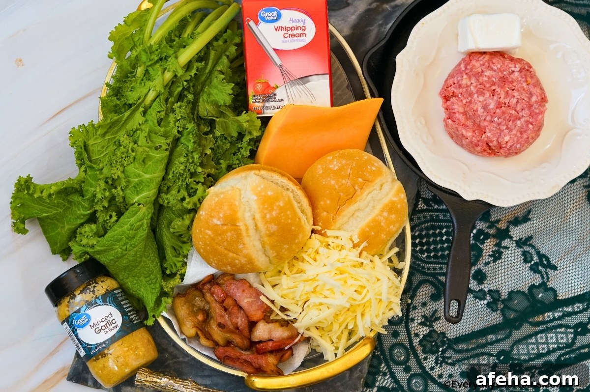 ingredients shown: minced garlic, bacon, cheese, hamburger buns, ground beef patty, cheese slices, heavy whipping cream and lettuce