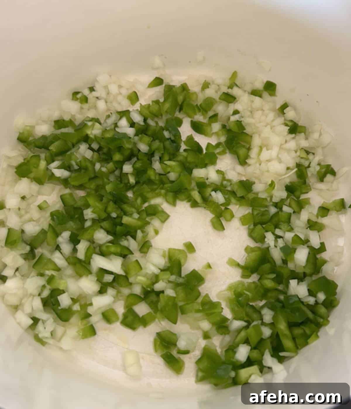 Green peppers and onions in dutch oven.