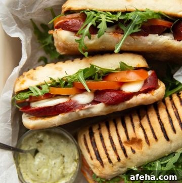 overhead shot of 3 sandwiches in dish with pesto mayo
