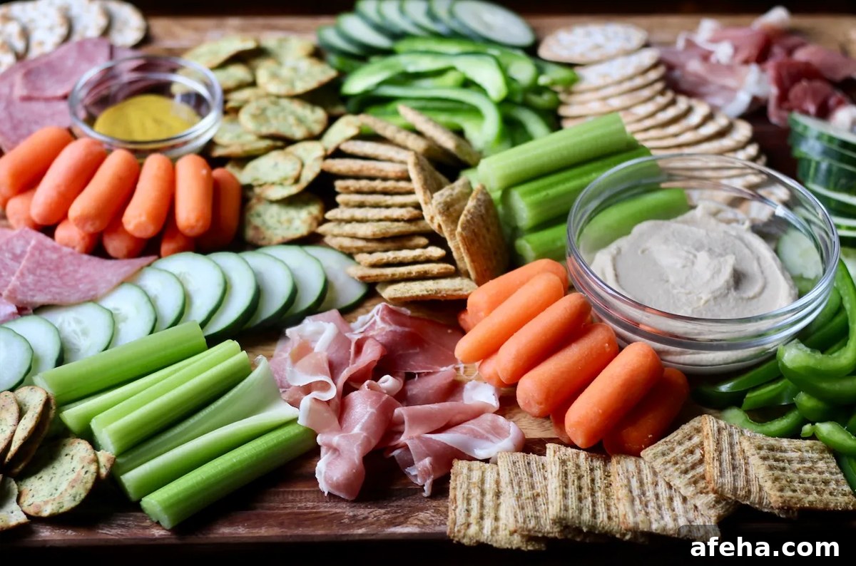 Life After Dairy's board showcases dips, celery, carrots, meats, crackers, and peppers.