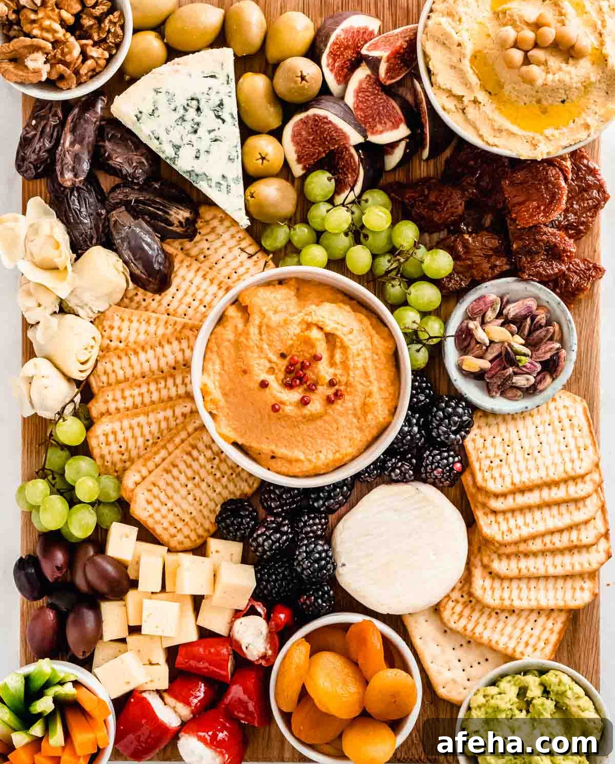 Vegan cheese, celery, olives, nuts, and crackers are displayed on Whole Soulfood Kitchen's Vegetarian board.