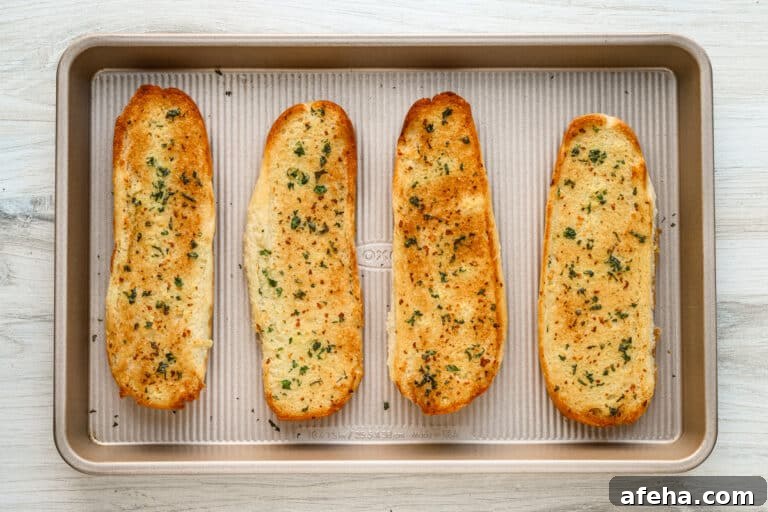 Broiled garlic bread with golden top.