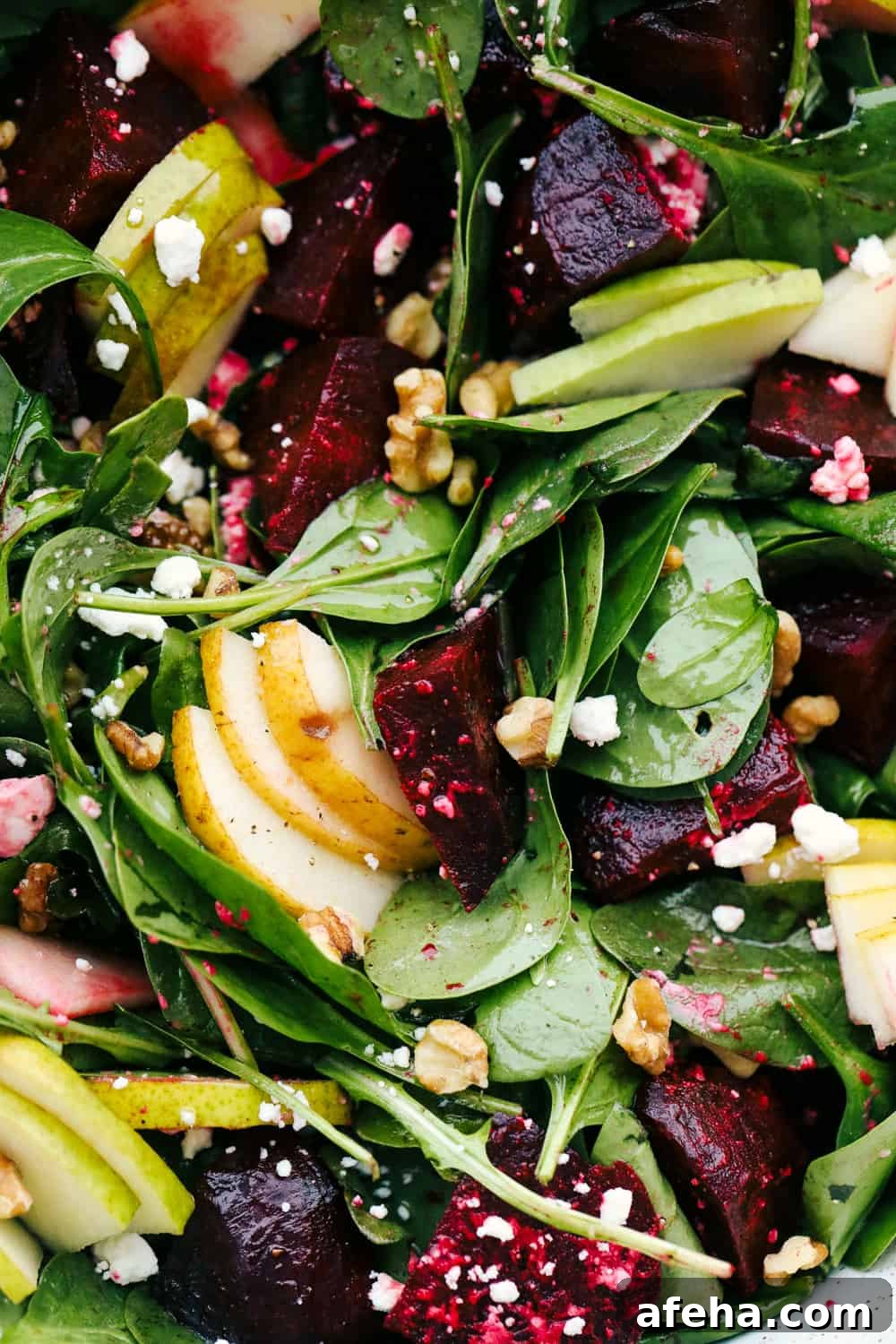 Pears, beets, feta, spinach and walnuts tossed together in a vinaigrette.