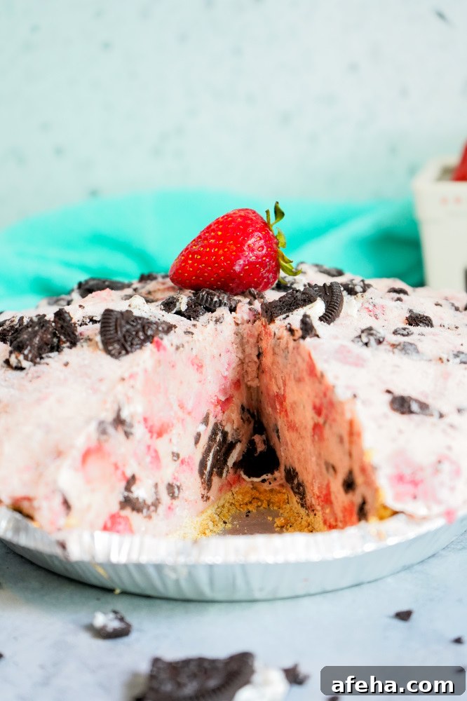 Mile High strawberry cookies n cream pie with slice missing