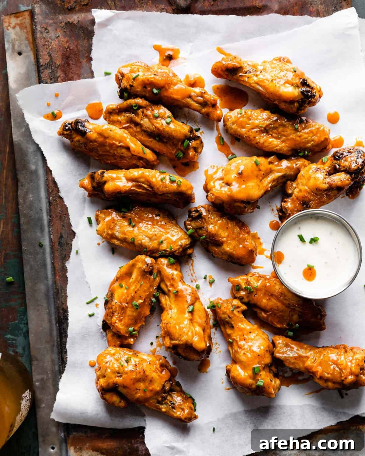 frozen chicken wings in air fryer tossed in buffalo sauce