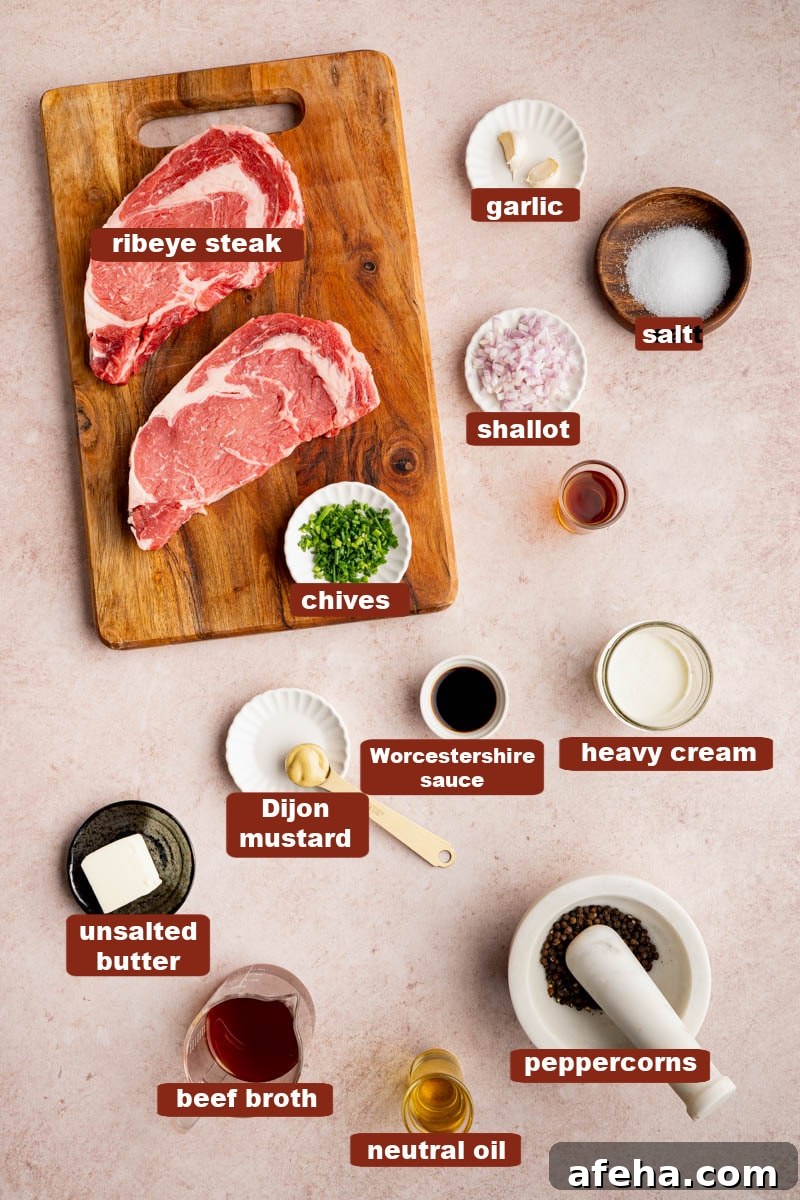 All of the ingredients for steak au poivre in bowls on a kitchen counter and the steak on a wooden cutting board.