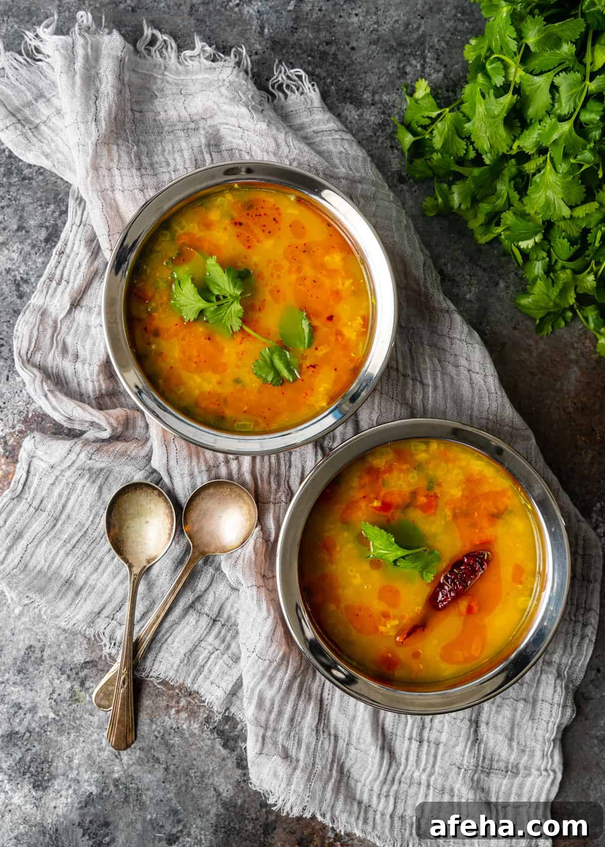 Creamy Dal Tadka Recipe: Authentic Indian Lentil Curry Guide 9 overhead: dal tadka recipe in two silver bowls