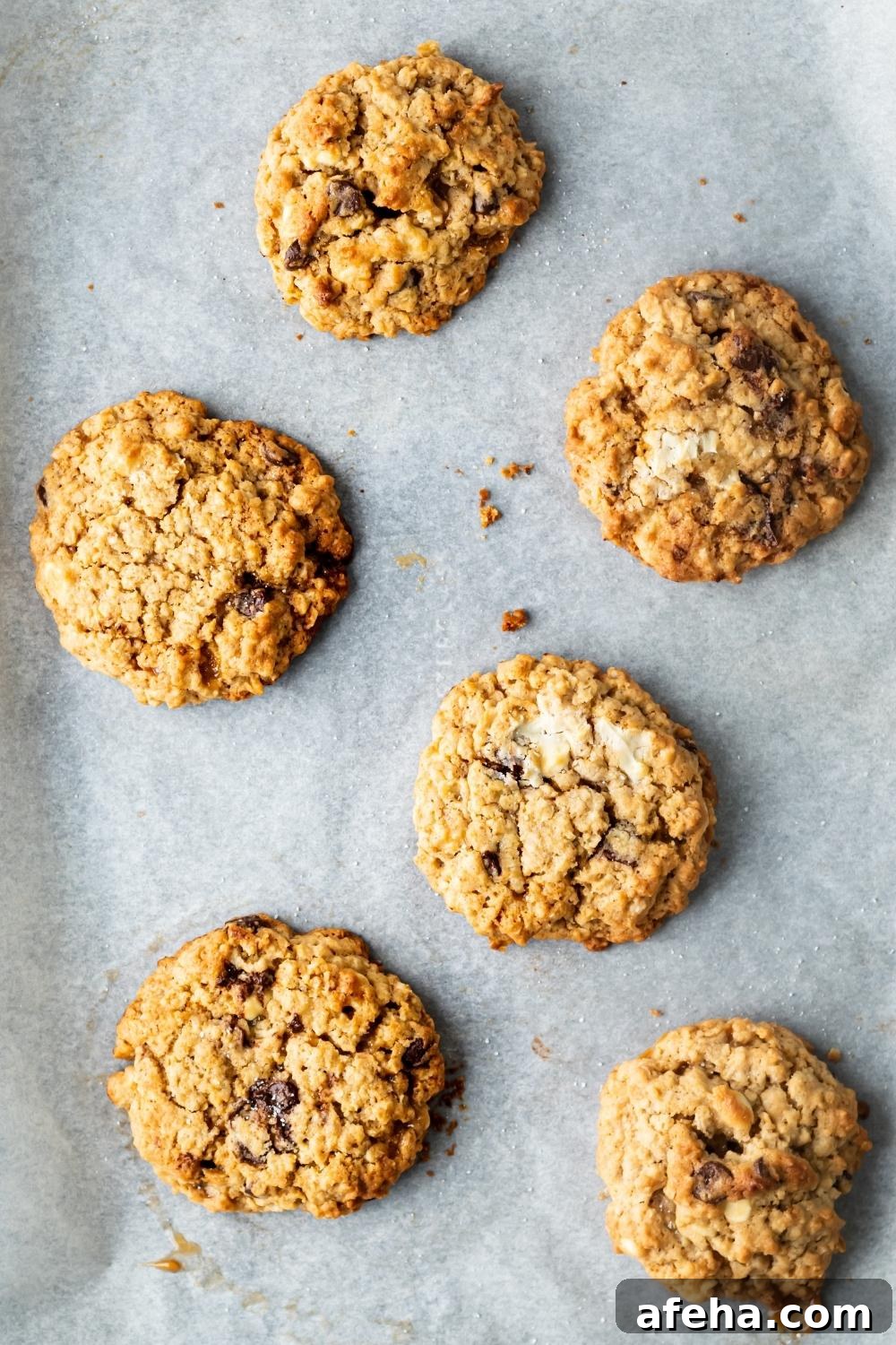 An overhead view of baked mom's recipe cookies on a parchment lined baking tray.