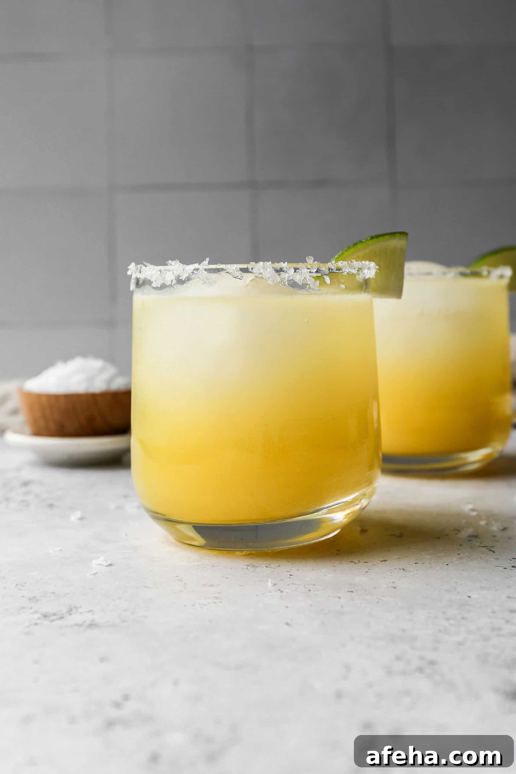 Classic Virgin Margarita Recipe: Refreshing Citrus Mocktail Guide 3 a glass of classic margarita mocktail with salt and lime on the rim.
