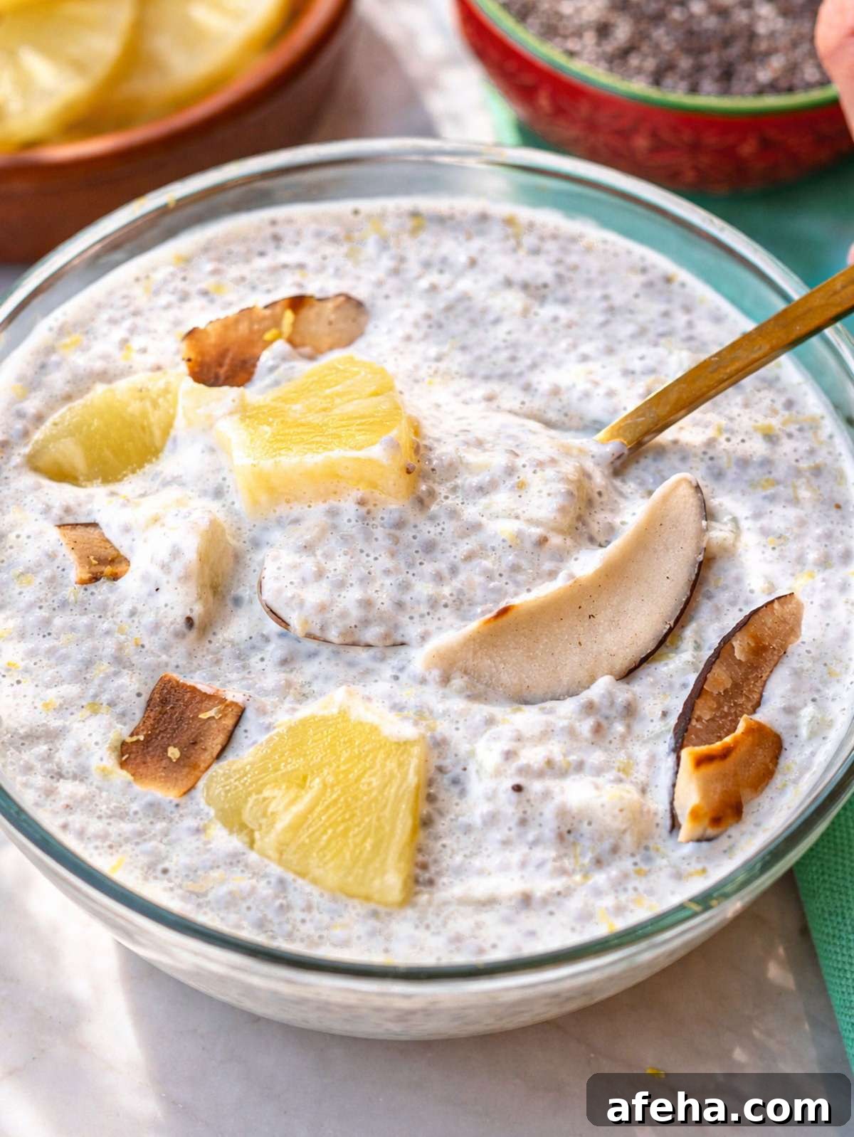 Close up of creamy pineapple chia pudding with visible chia seeds.