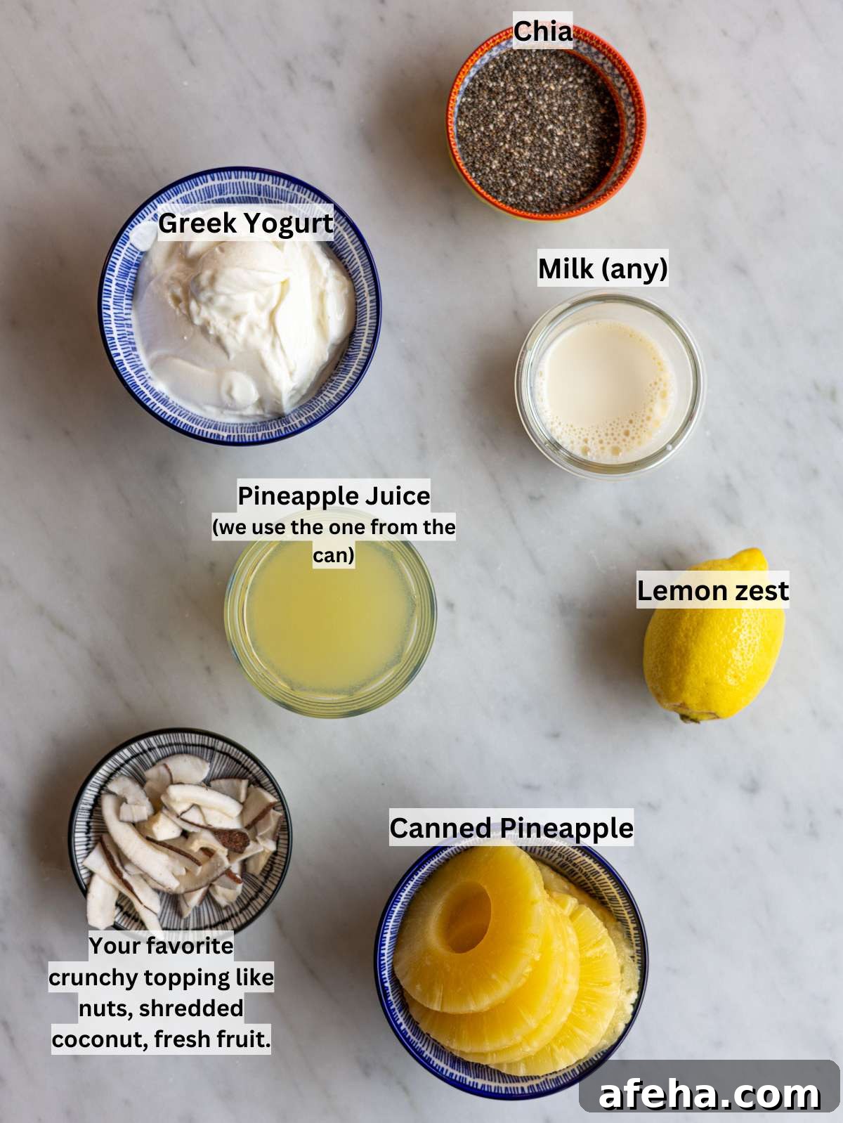 Chia seeds, Greek yogurt, canned pineapple, milk, and lemon on wooden table.