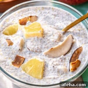 Bowl of pineapple chia pudding on sunlit table with spoon.