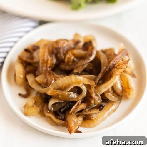 A plate of caramelized onions, golden brown and slightly crispy.
