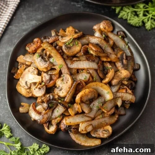 Sauteed mushrooms and onions on a plate.