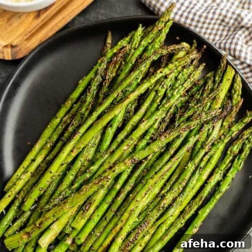 Blackstone Asparagus placed on a black plate.