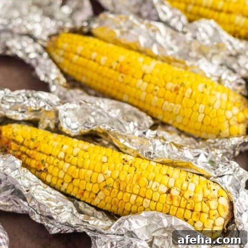 Corn on the Cob placed on a top of aluminum foil.