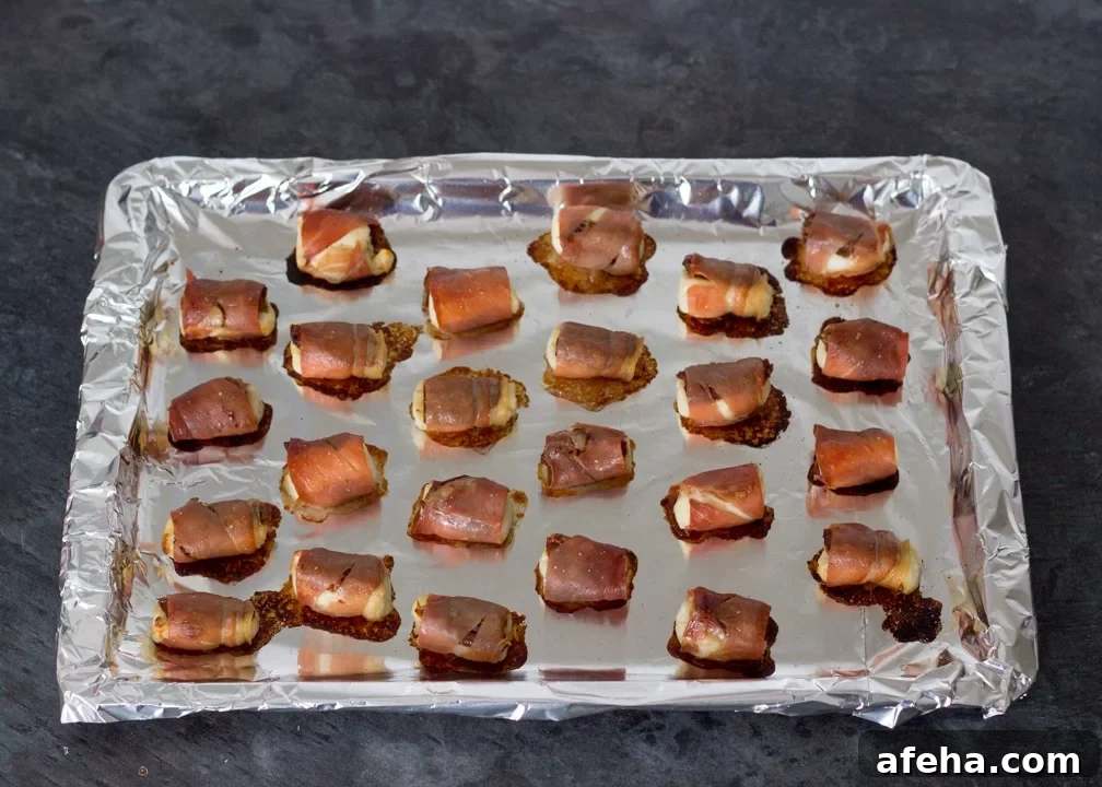 Party Snacks: Halloumi & sundried tomatoes wrapped in prosciutto cooked on a baking tray