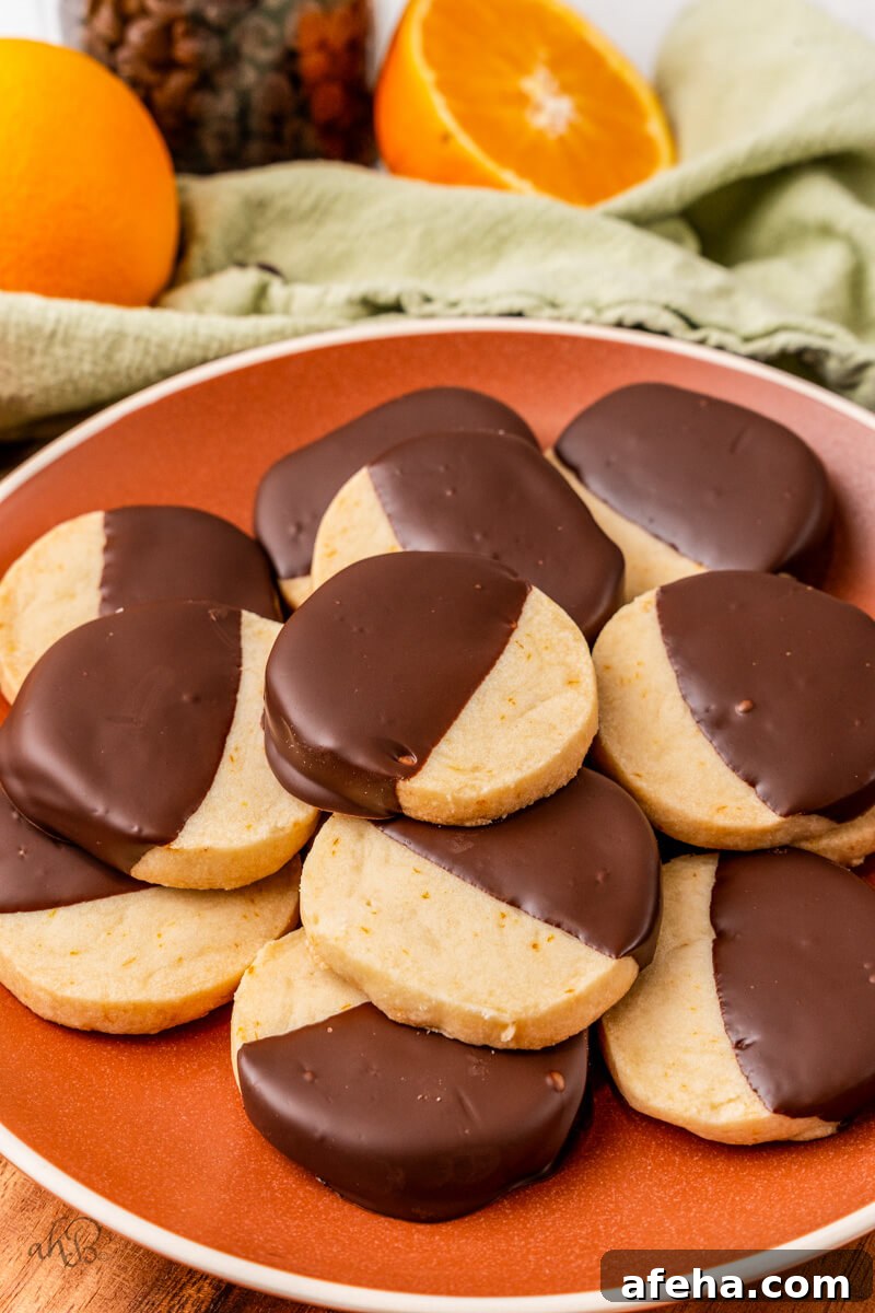 A red plate full of chocolate Orange Shortbread Cookies.