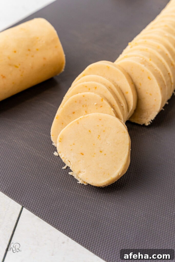 The log is cut into slices of cookie dough.