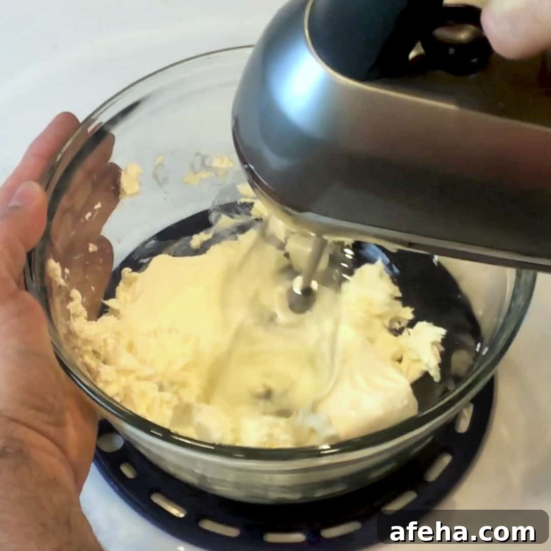 Use a mixer to blend the cream cheese until smooth.