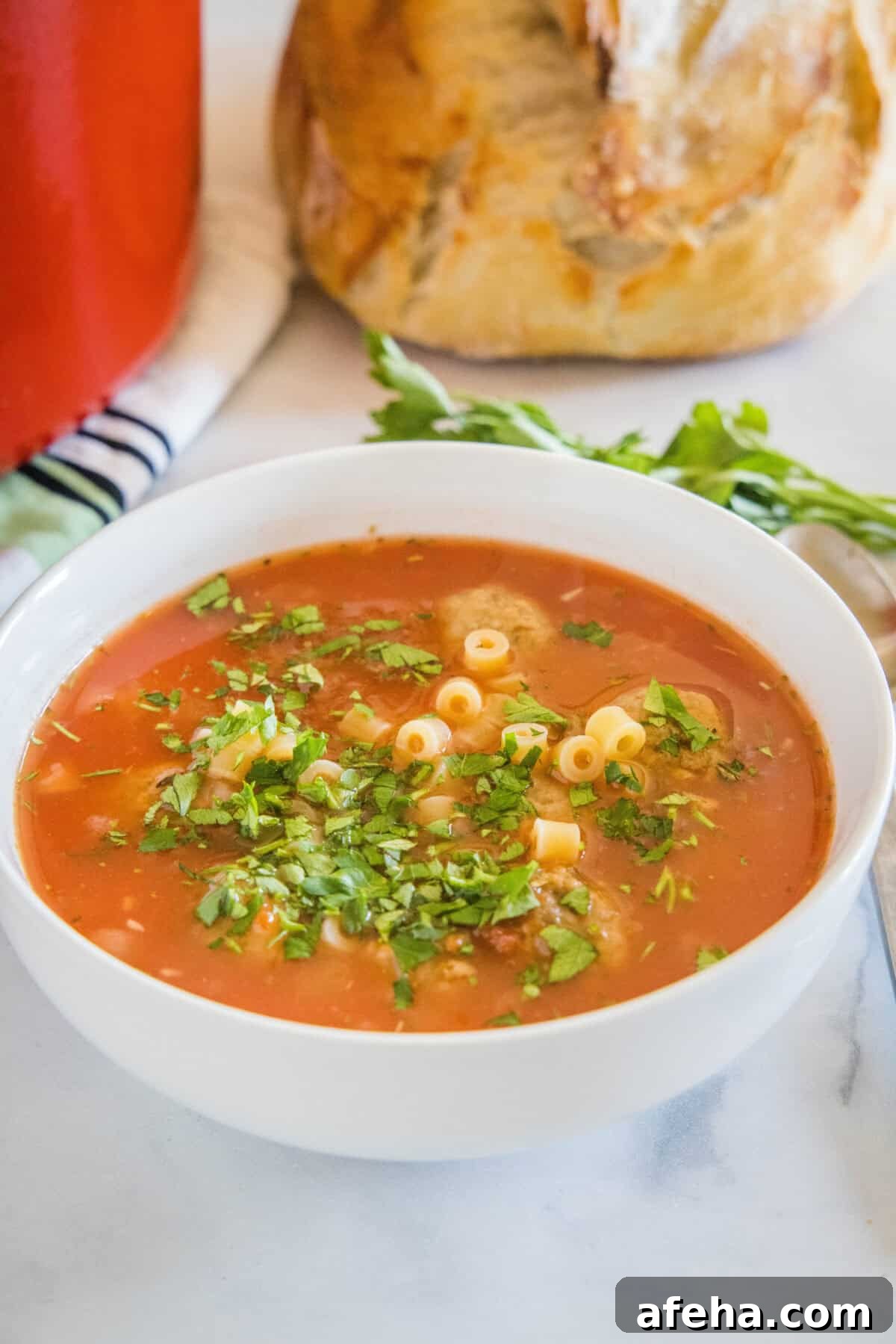 Hearty Italian Meatball Soup Recipe with Tender Meatballs 5 italian meatball soup topped with parsley