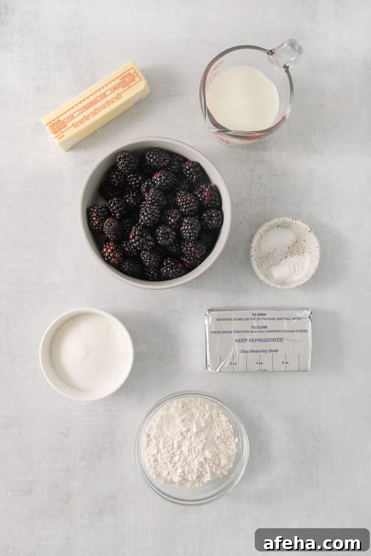 Blackberry Cobbler with Cream Cheese Swirl: Rustic Summer Dessert 3 a bowl of berries, milk, and other ingredients to make a dessert.