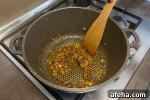 Spicy Satsebeli: Authentic Georgian Tomato Sauce Recipe 7 Cooking the onion and spices