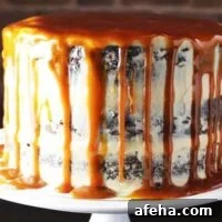 Caramel chocolate cake on a plate with coconut caramel frosting and caramel drizzle