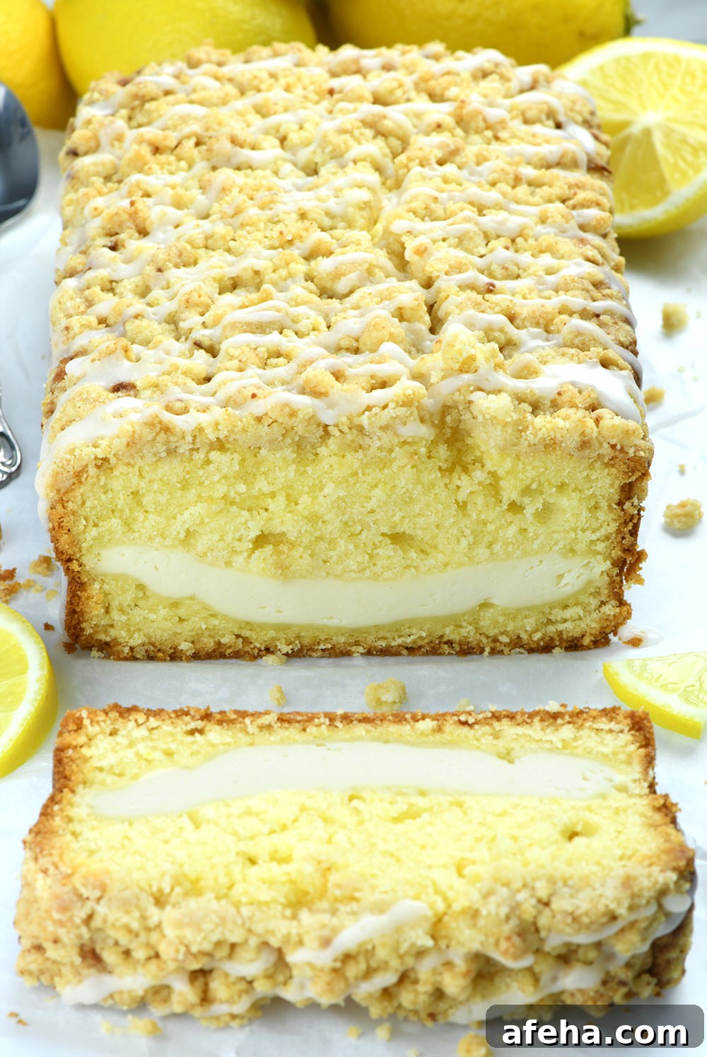 Lemon Cream Cheese Pound Cake Recipe with Luscious Glaze 3 Half sliced pound cake with lemon decorations.