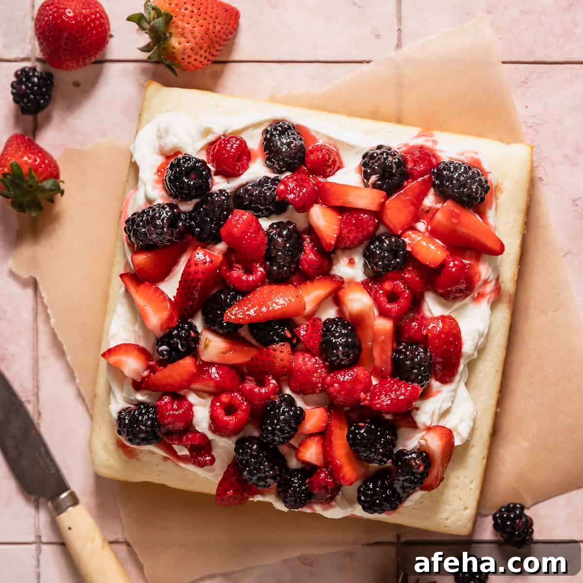 lemon berry mascarpone cake with fresh berries.