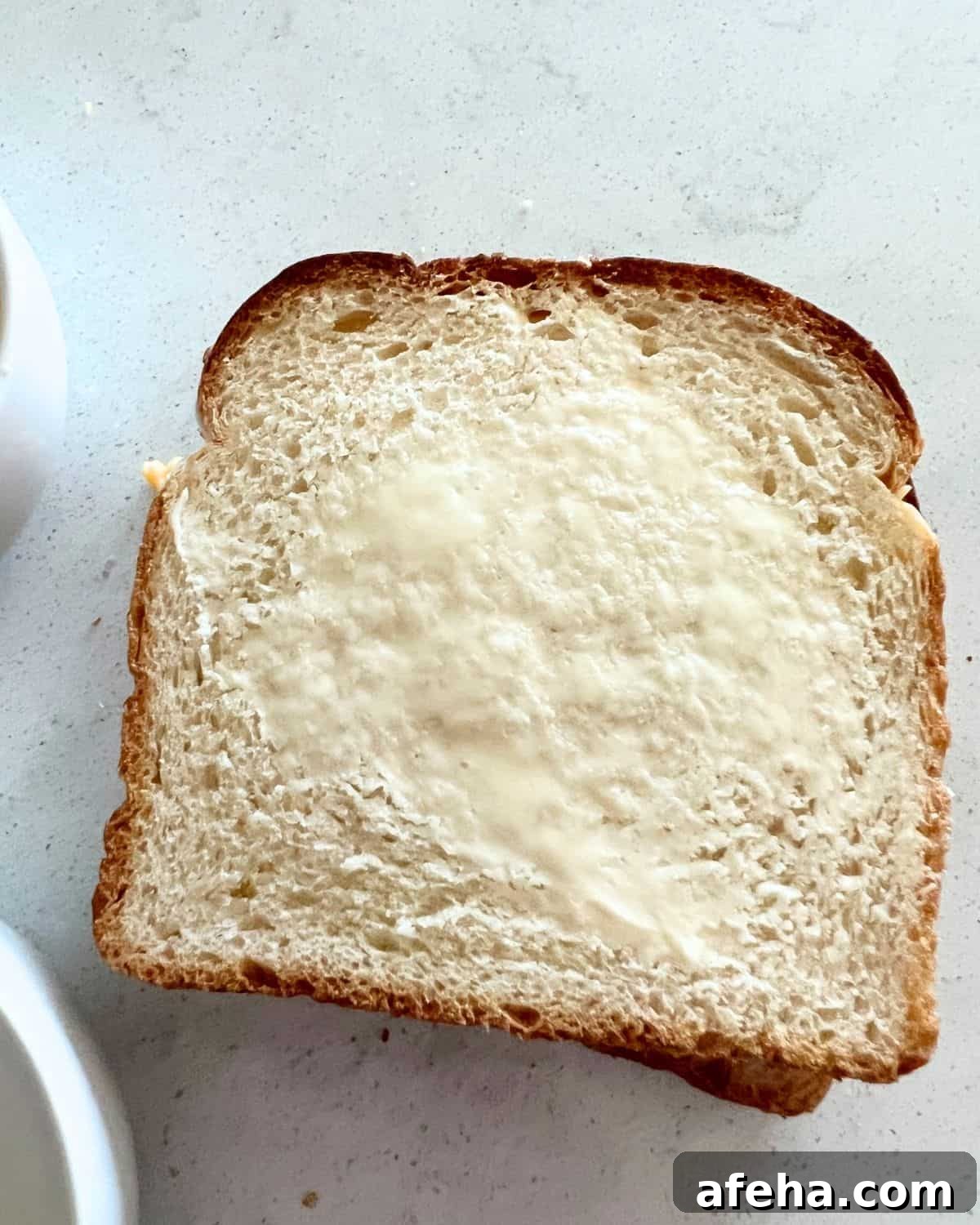 Crispy Air Fryer Grilled Cheese with Mayo Spread 5 Buttered bread for air fryer grilled cheese sandwich.