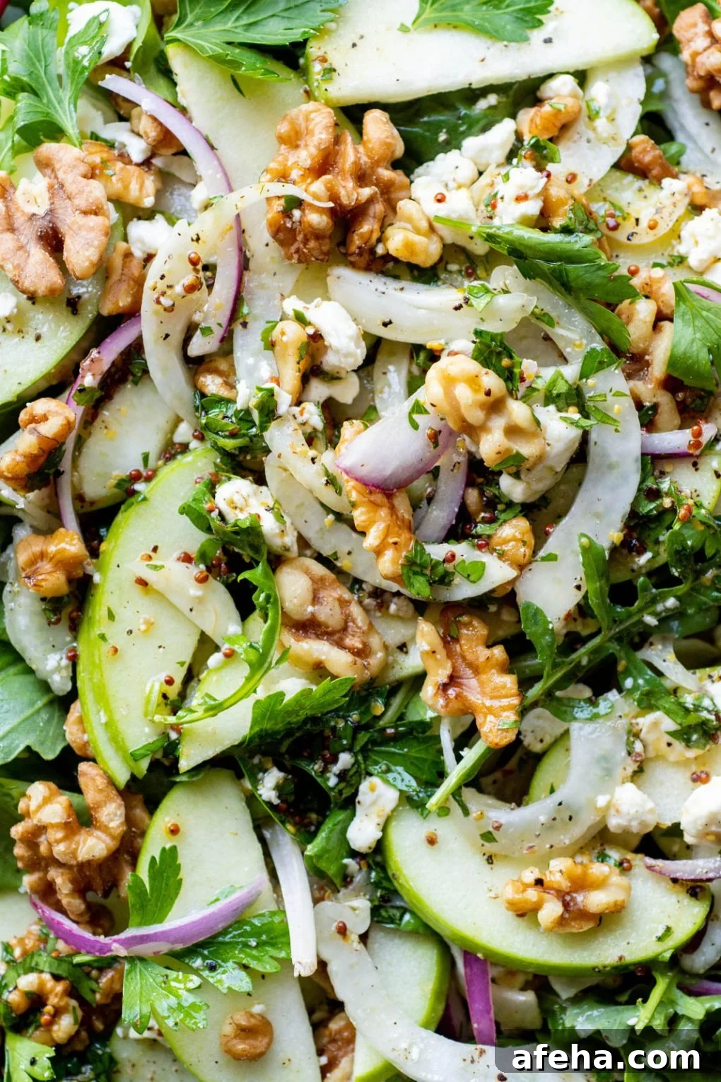 Super close up macro shot of healthy apple walnut salad.
