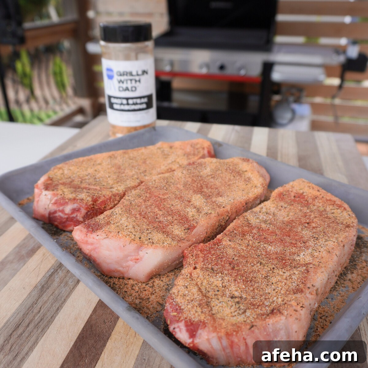 seasoned NY strip steaks.