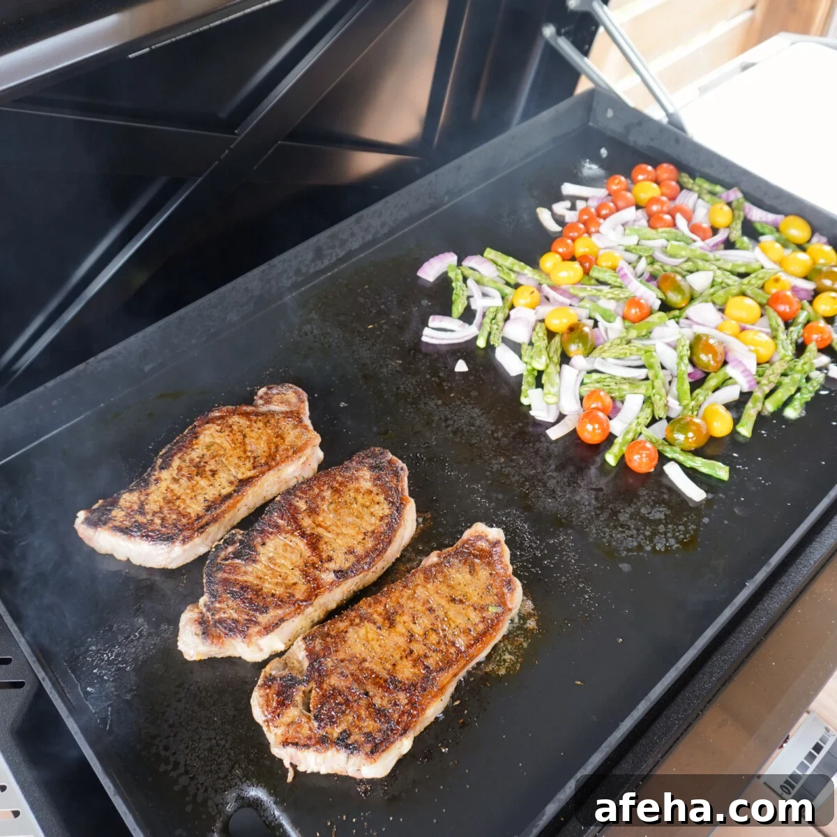 easy steak and veggies dinner grilled on a griddle.