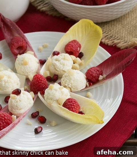 Endive Cups with Blue Cheese, Raspberries and Macadamia Nuts.