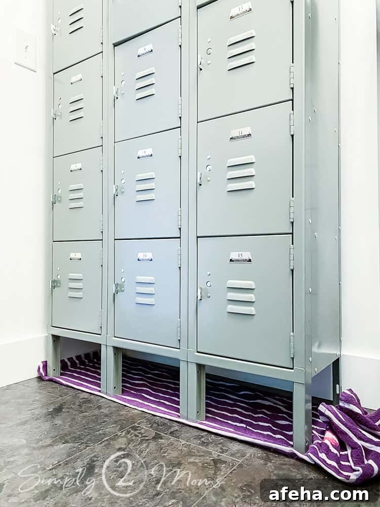full view of school lockers against wall with towel under legs on floor