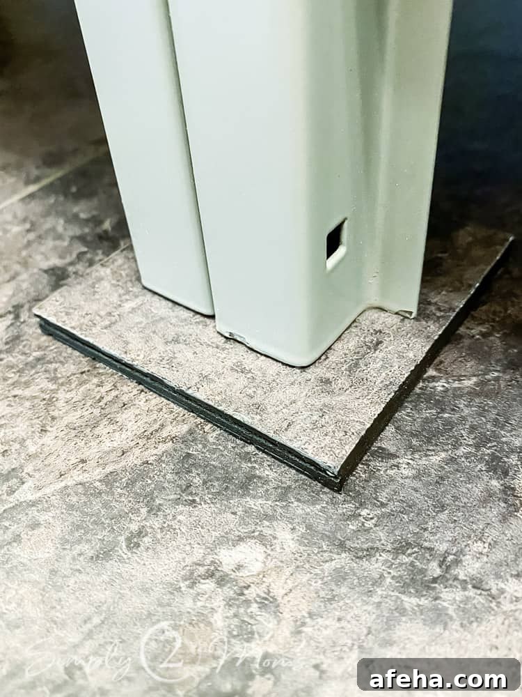 close up of diy floor coaster made out of extra vinyl flooring under locker legs