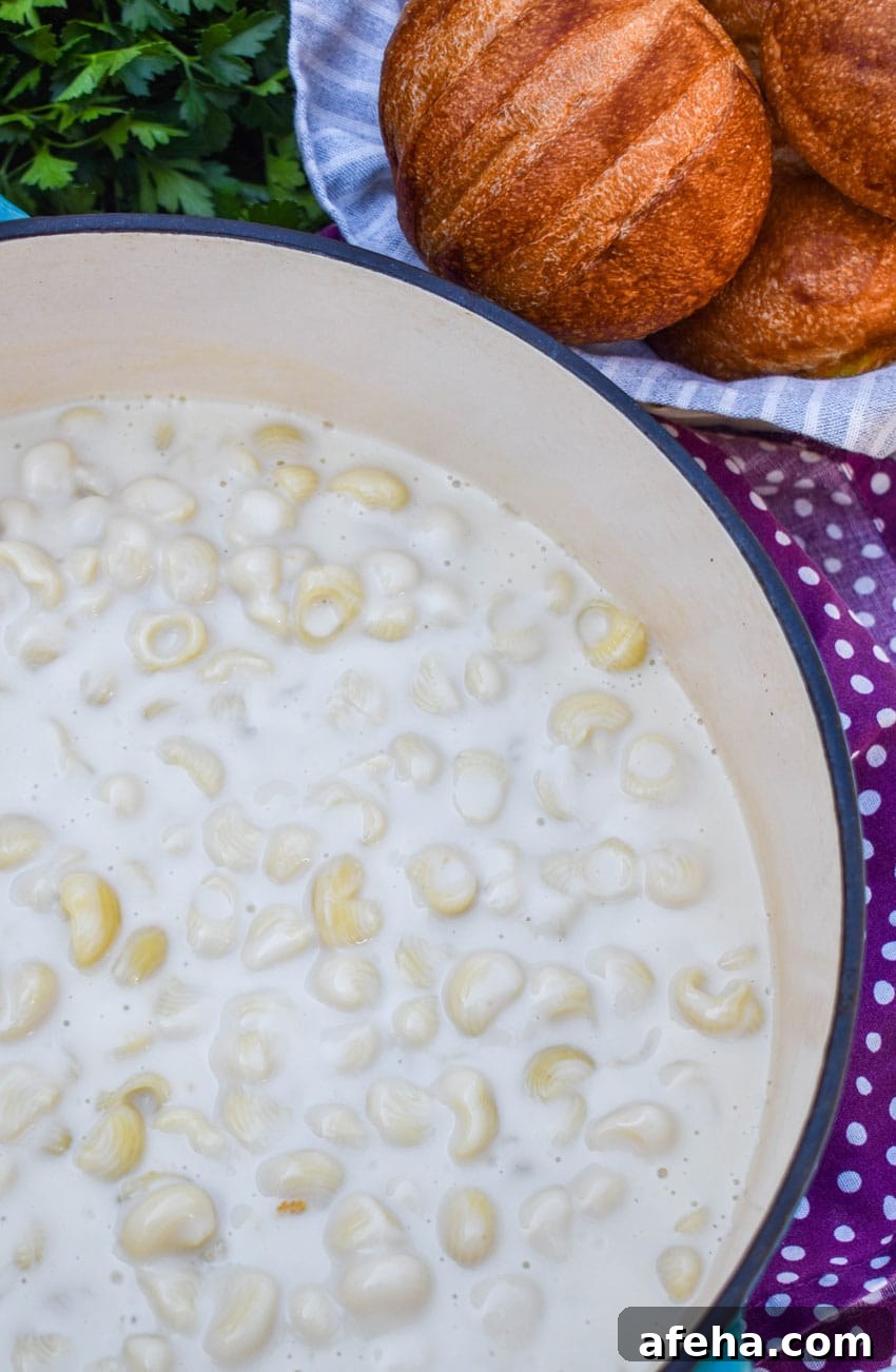 Panera Mac and Cheese Copycat Recipe: Creamy, Restaurant-Style 4 homemade panera bread mac and cheese in a red dutch oven