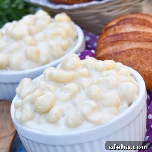 Panera Mac and Cheese Copycat Recipe: Creamy, Restaurant-Style 8 copycat panera mac and cheese recipe shown in two white ramekins with crusty rolls on the side