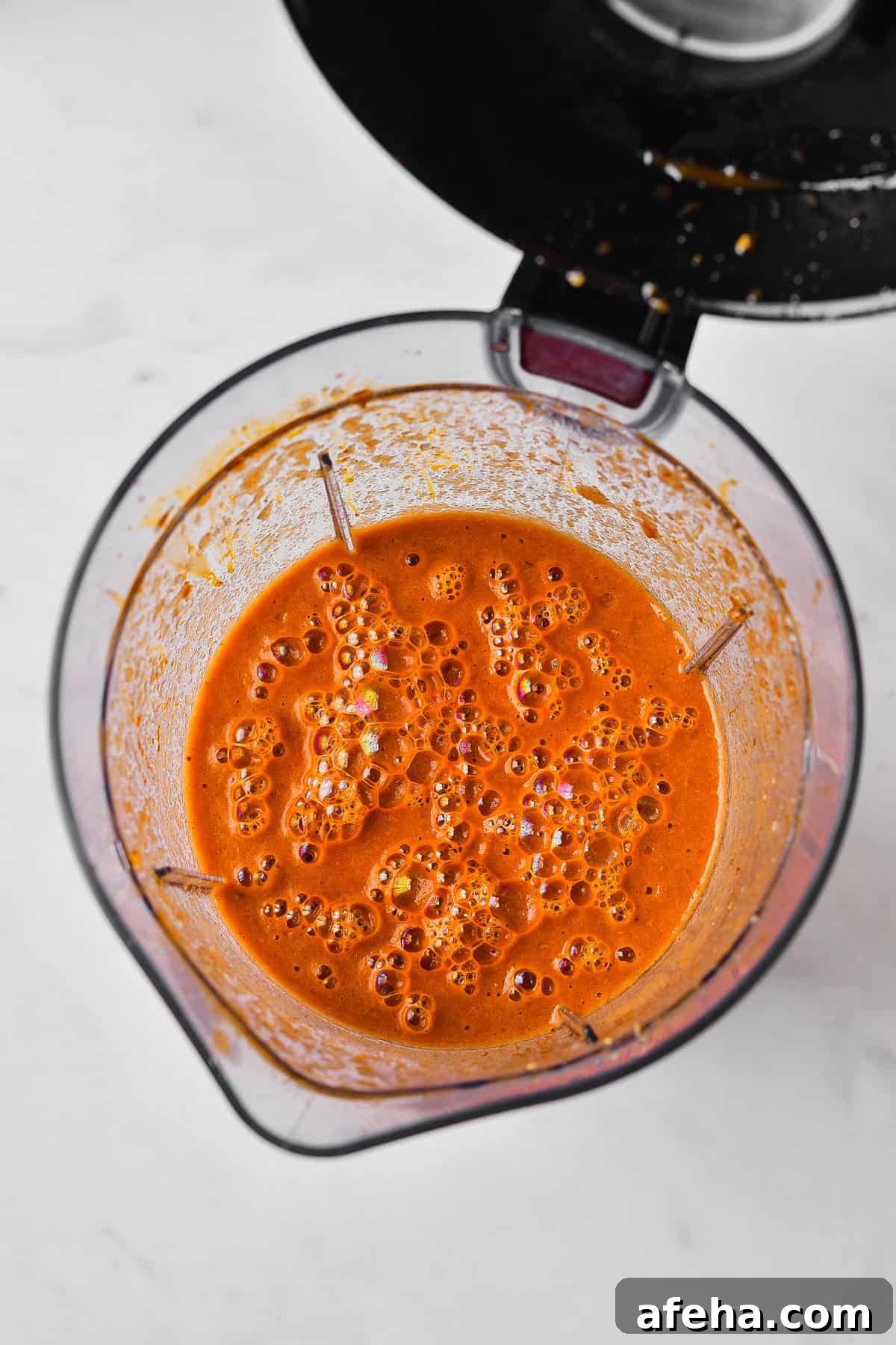 Authentic Chicken Tinga Recipe: Smoky Mexican Shredded Chicken 8 Blended sauce in pitcher.