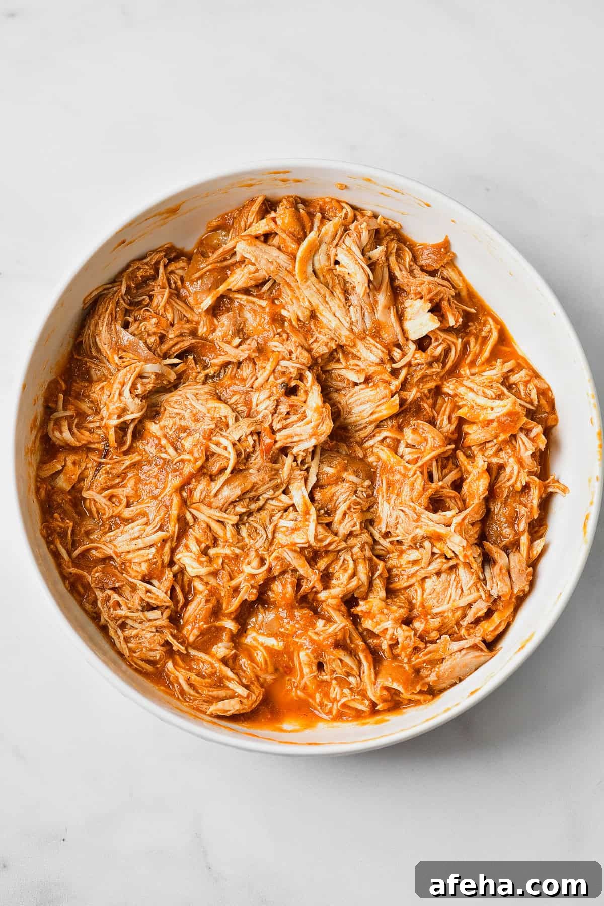 Authentic Chicken Tinga Recipe: Smoky Mexican Shredded Chicken 9 The shredded chicken in the tinga sauce.