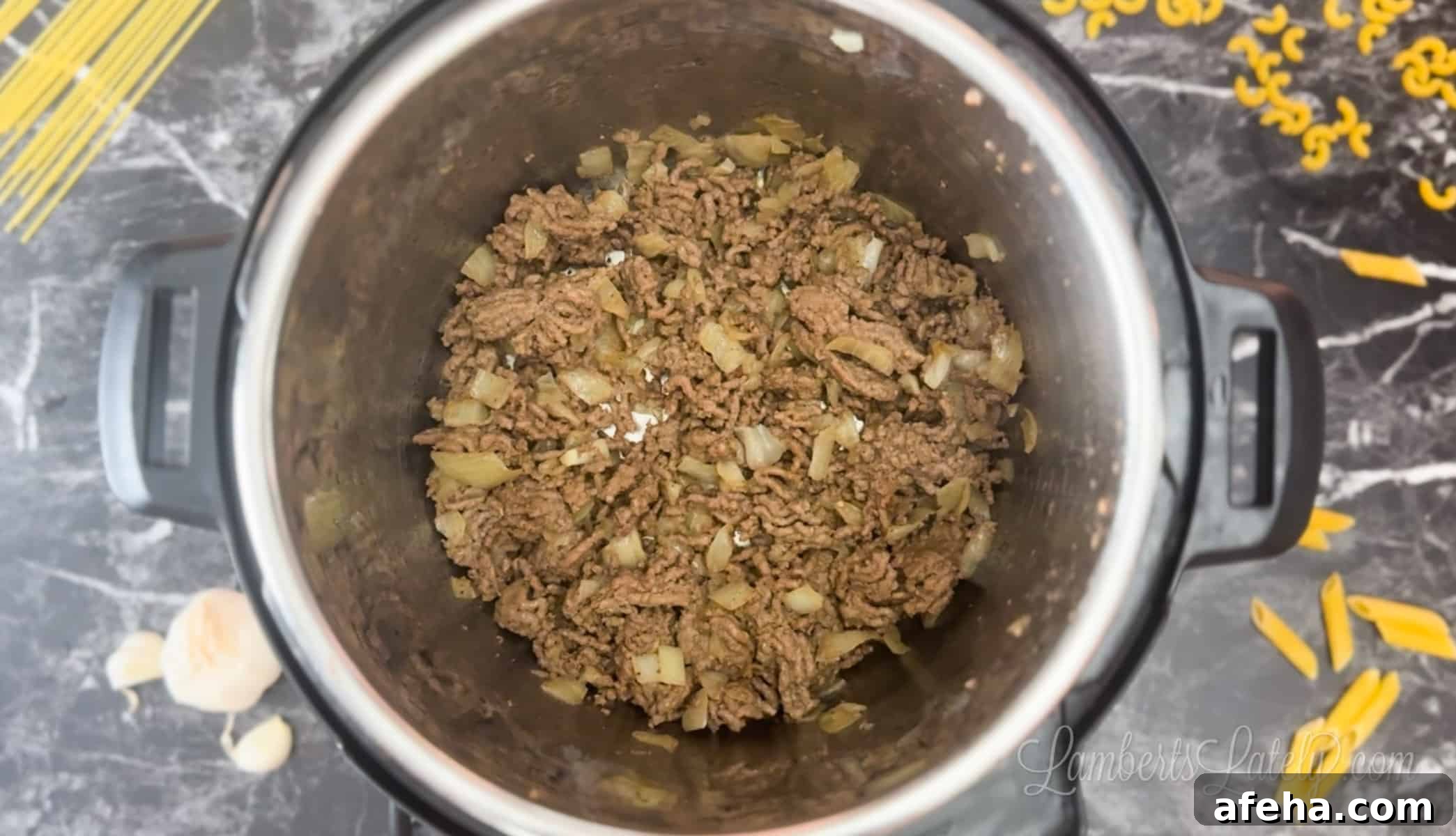 cooking ground beef and onion in an instant pot.