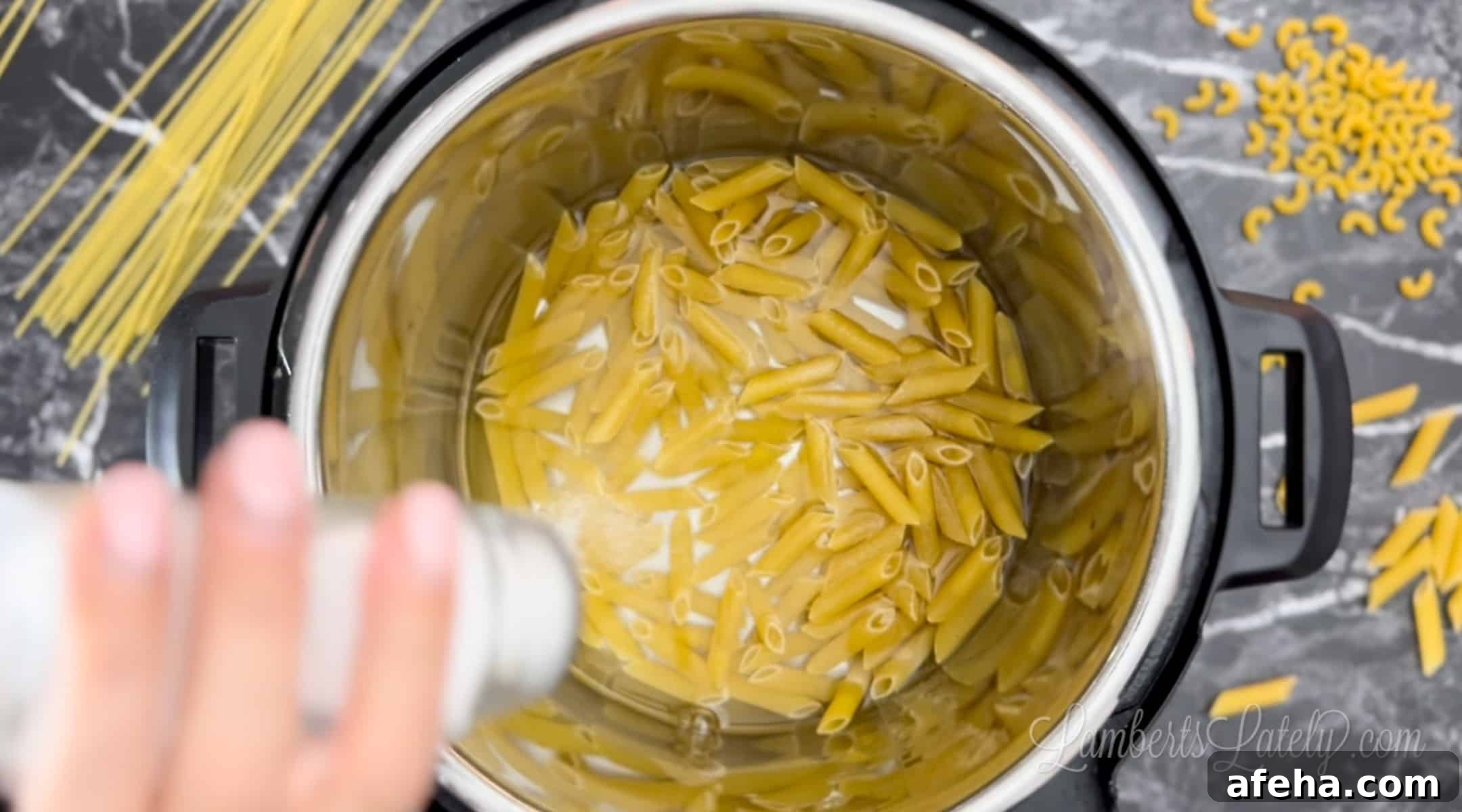 adding salt to pasta and water in an instant pot.