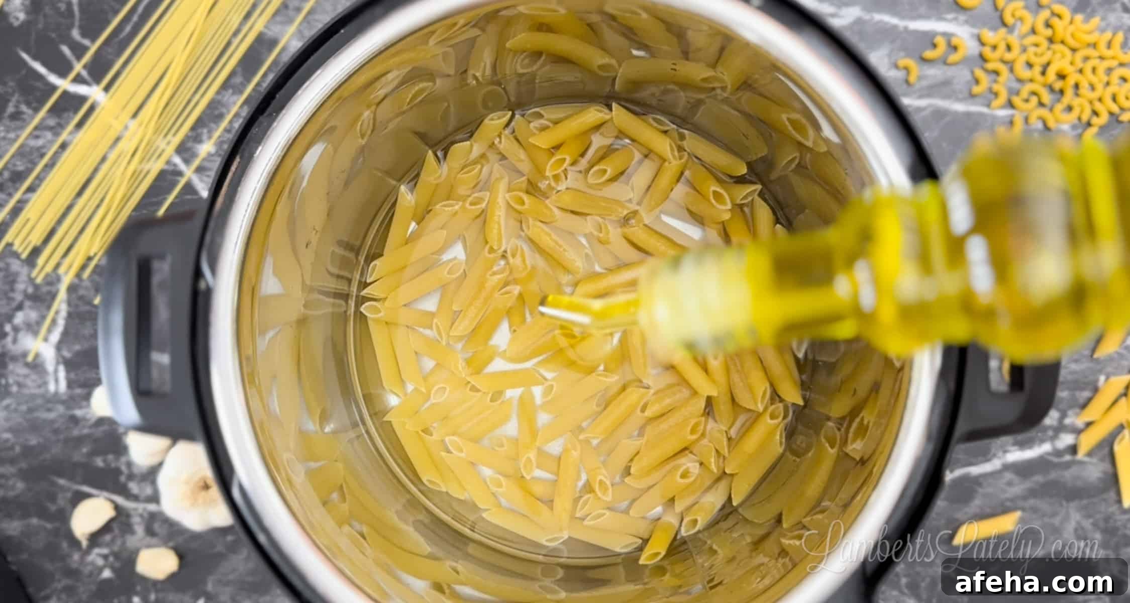 adding olive oil to pasta and water in an instant pot.