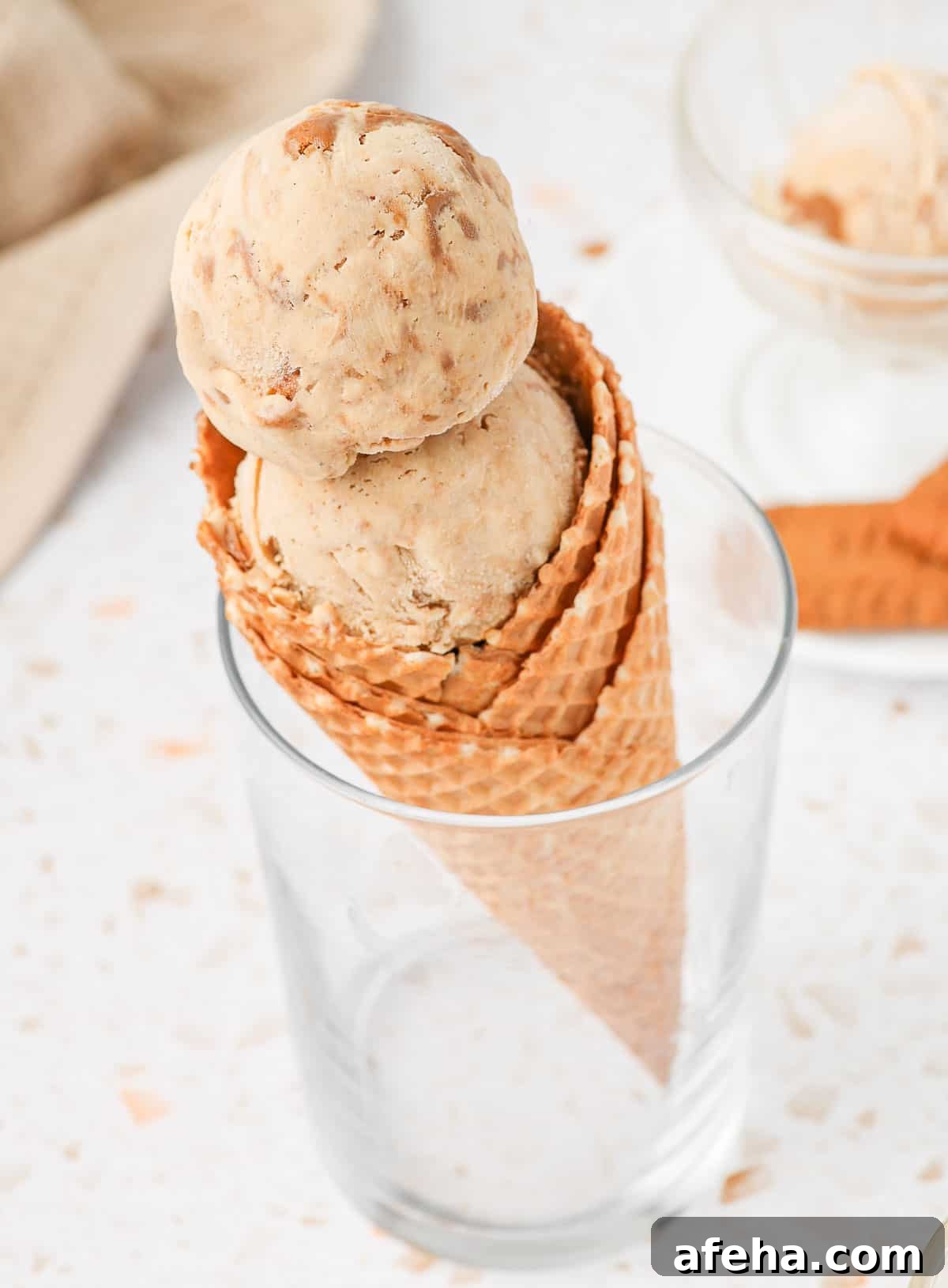 Two scoops in a waffle cone.